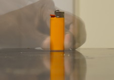 Ghostly image of the light standing being held by a transparent hand