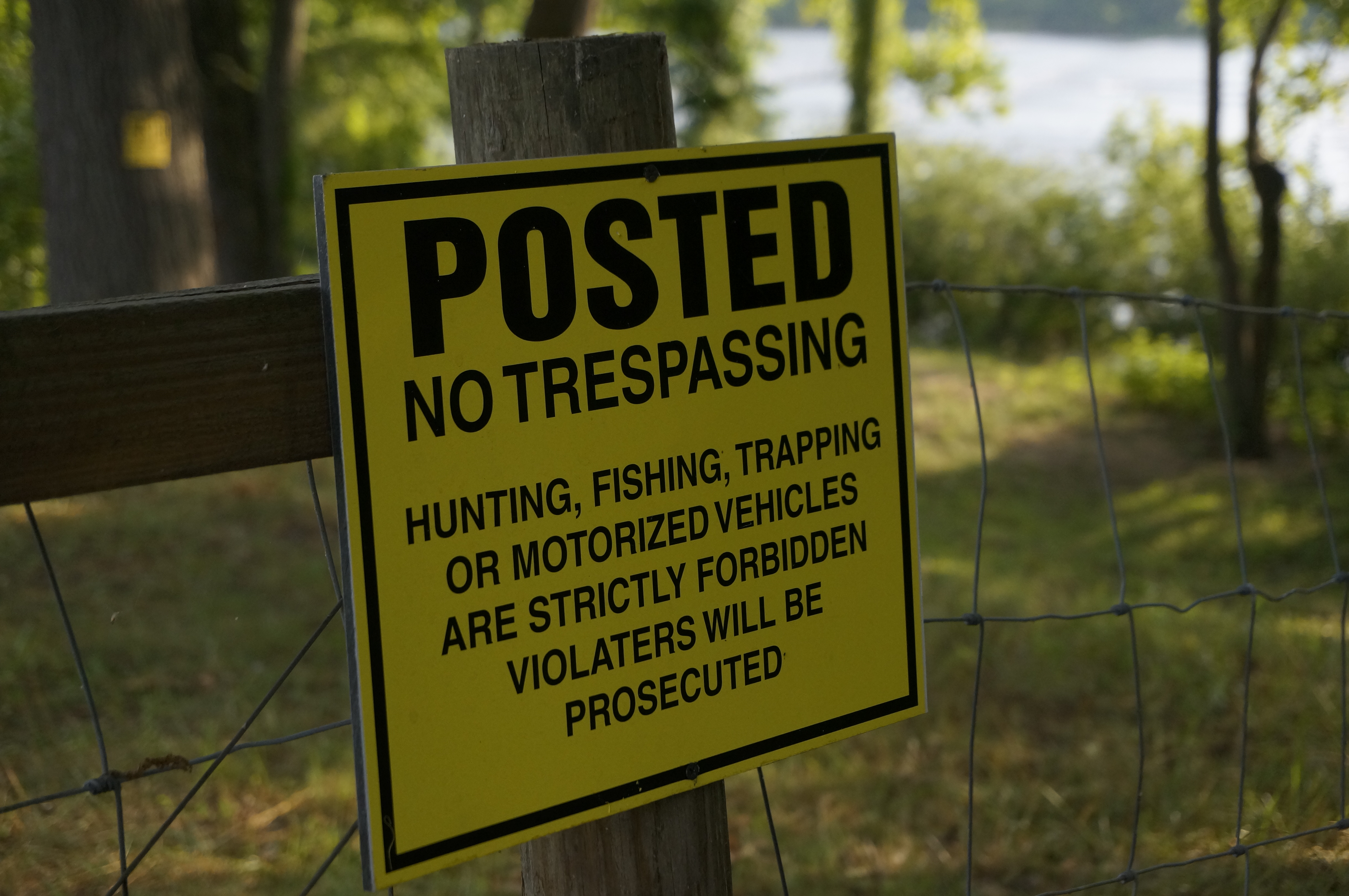 No Trespassing Sign attached to wire fence